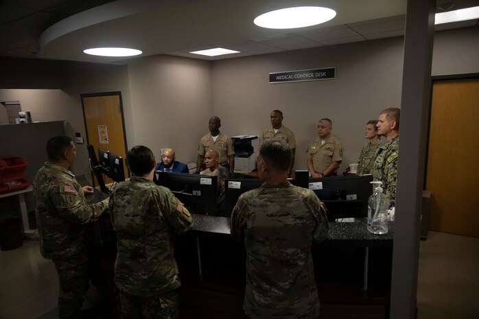 U.S. Marine Corps Brig. Gen. David Hyman, commanding general of Marine Corps Western Recruiting Region and Marine Corps Recruit Depot San Diego, receives a brief at Chicago Military Entrance Processing Station, Chicago, Illinois, 17 Sept. 2025. General Hyman visited Chicago MEPS during a routine visit to Marine Corps Recruiting Station Chicago, during which he awarded several employees and service members with a challenge coin for a job well done. (U.S. Marine Corps photo by Sgt. Dalton J. Payne)