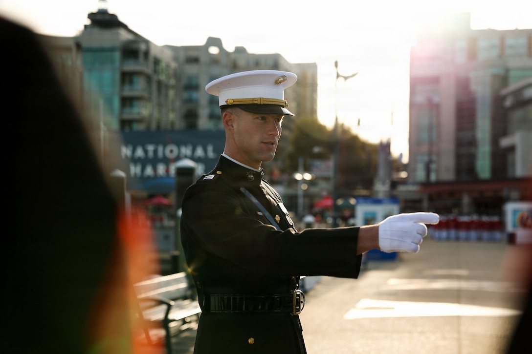U.S. Marine Corps Capt. Ford Higgins, platoon commander, United States. Marine Corps Silent Drill Platoon, Alpha Company, Marine Barracks Washington, briefs the platoon prior to their performance during the opening ceremony of the 50th Marine Corps Marathon at National Harbor, Maryland, Oct. 25, 2025. The ceremony included a three-mile motivational run, performances by the Silent Drill Platoon and the U.S. Marine Corps Drum & Bugle Corps, and remarks from Lt. Gen. Jerry Carter, deputy commandant for information. The Marine Corps Marathon, known as “The People’s Marathon,” unites military and civilian communities in a shared celebration of endurance, service, and pride. (U.S. Marine Corps photo by Lance Cpl. Brynn L. Bouchard)