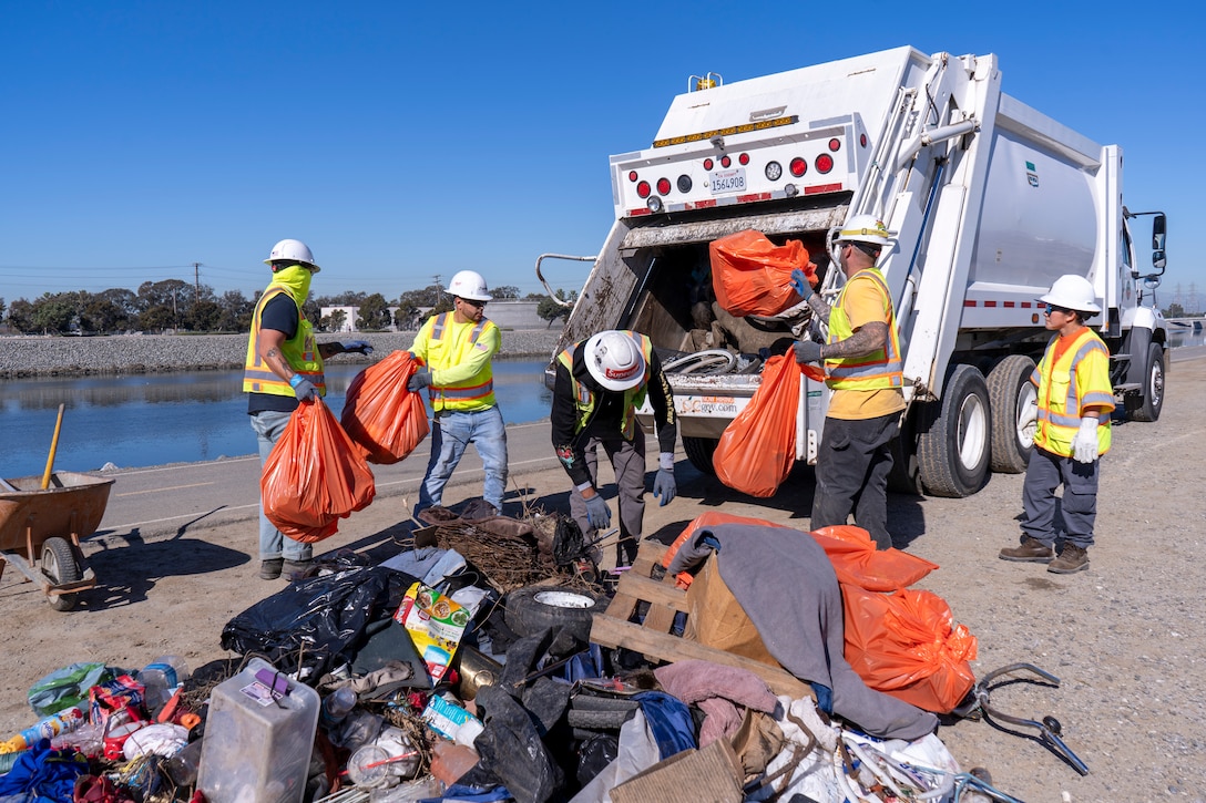 Members of the U.S. Army Corps of Engineers Los Angeles District, Orange County Public Works and the city of Newport Beach remove debris Dec. 10 at the lower Santa Ana River Marsh. About three tons of material were collected during the operation.