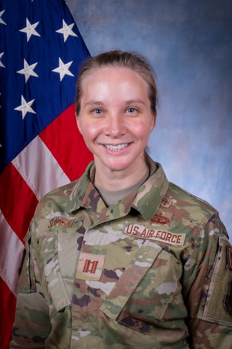 Airman smiles for official photo.