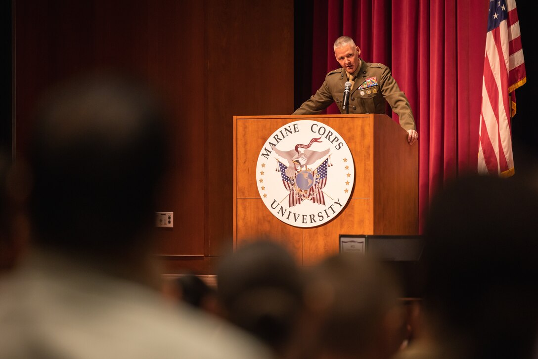 U.S. Marine Corps Brig. Gen. Matthew Tracy, commanding general of Education Command and president of Marine Corps University, addresses new students during the 2024-2025 academic year convocation ceremony on Marine Corps Base Quantico, Virginia, Aug. 2, 2024. MCU/Education Command educates Marines to prevail in combat by fostering a culture of continuous professional military education, strategic thinking, and excellence, equipping our graduates to face future challenges. (U.S. Marine Corps photo by Lance Cpl. Joaquin Dela Torre)
