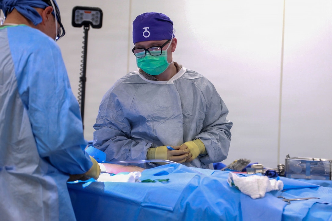 A U.S. Navy Hospital Corpsman with 1st Battalion, 5th Marine Regiment, 1st Marine Division, uses a battlefield assisted trauma documentation kit to document care during a simulated mass casualty exercise during Exercise Steel Knight 25 at Marine Corps Base Camp Pendleton, California, Dec. 6, 2025. Steel Knight is an annual exercise that strengthens the Navy-Marine Corps team's ability to respond forward, integrate across domains, and sustain Marine Air-Ground Task Force readiness. (U.S. Marine Corps photo by Cpl. Michael Bartman)