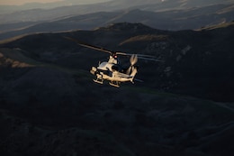 A U.S. Marine Corps AH-1Z Viper assigned to Marine Light Attack Helicopter Squadron (HMLA) 367, Marine Aircraft Group 39, 3rd Marine Aircraft Wing, flies following a live-fire Close Air Support training mission in support of exercise Steel Knight 25 at Marine Corps Base Camp Pendleton, California Dec. 9, 2025.