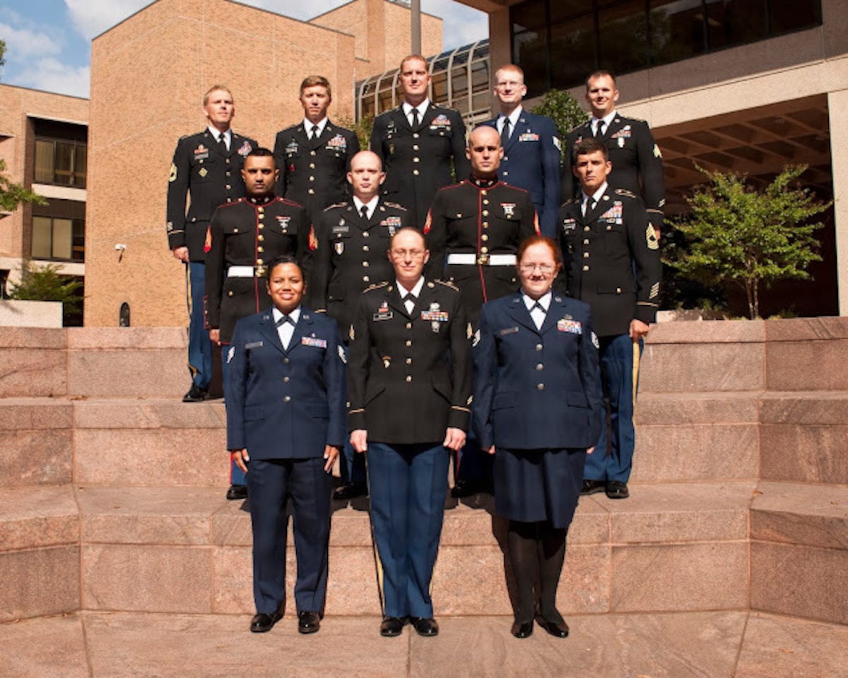 Airmen stand together for group photo.