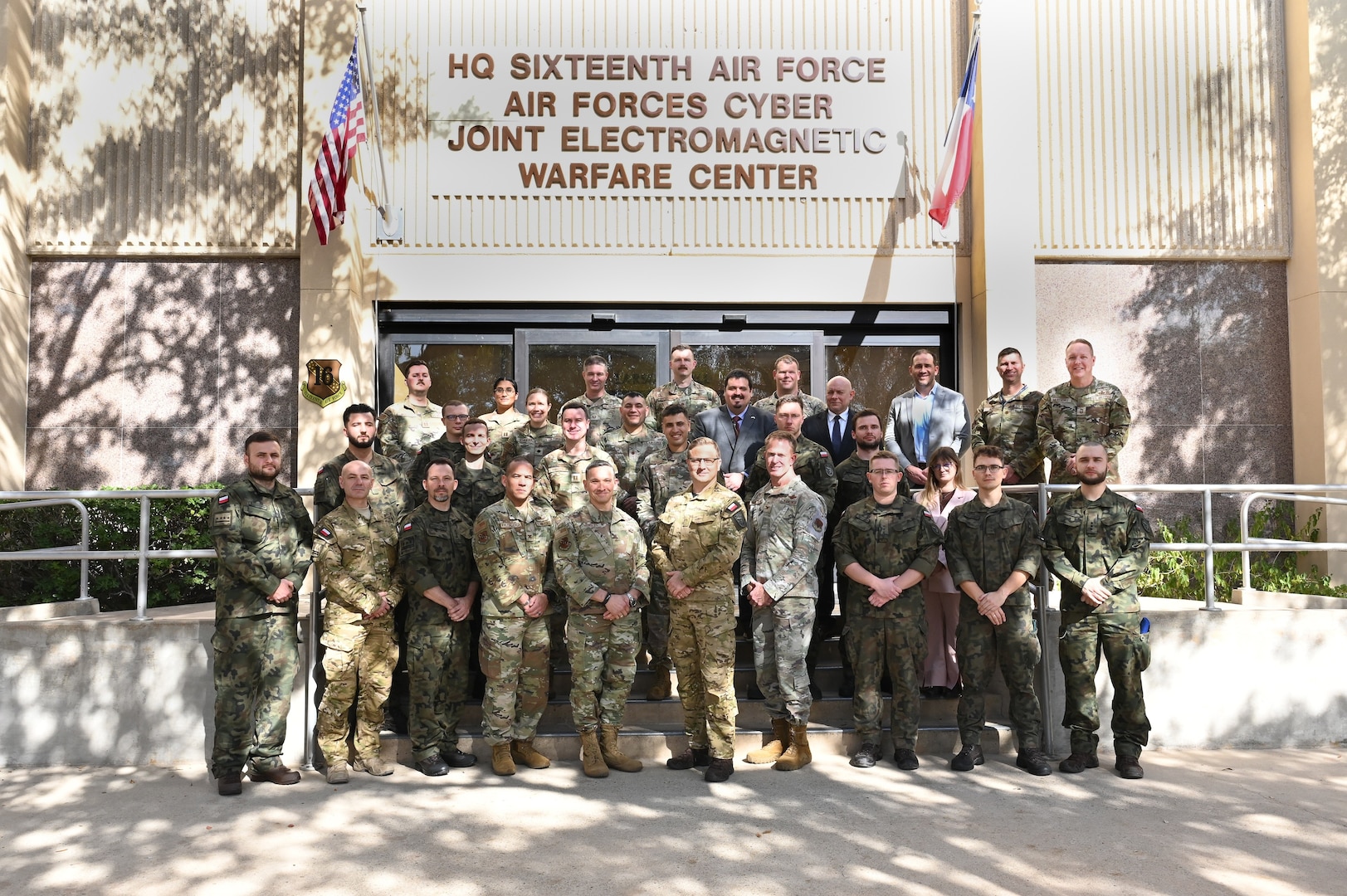 Sixteenth Air Force and Polish Cyber Command leadership pose for a group photo.