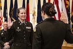 U.S. Army Col. Kara Schmid, left, administers the military oath of office to Lt. Col. Andrea Mountney, Fort Detrick, Maryland, Nov. 1, 2024. Schmid is director of the Center for Military Psychiatry and Neuroscience, Walter Reed Army Institute of Research, and Mountney is a military deputy project manager with the U.S. Army Medical Materiel Development Activity. Family, friends, colleagues, and teammates joined Mountney for her promotion to lieutenant colonel during the ceremony. USAMMDA, the Department of War’s premier developer of world-class military medical capabilities, develops, delivers, and fields critical drugs, vaccines, biologics, devices, and medical support equipment to protect and preserve the lives of Warfighters across the globe. (U.S. Army Photo by T.T. Parish)