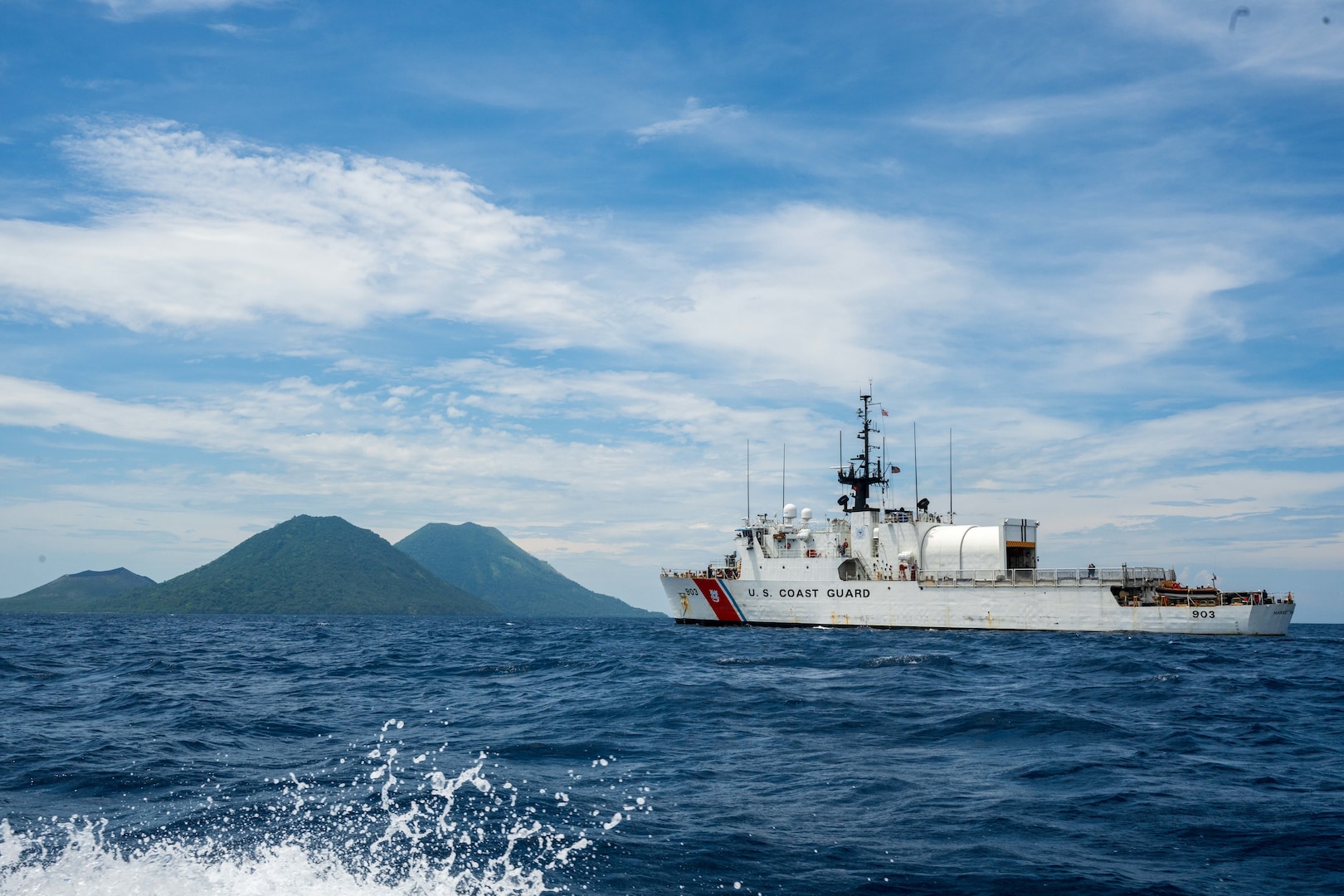 The medium endurance cutter USCGC Harriet Lane (WMEC 903) transits offshore Rabaul, Papua New Guinea, Oct. 26, 2025. Commissioned in 1984, the Harriet Lane is a 270-foot cutter homeported in Honolulu to support Coast Guard missions in the Pacific region. (U.S. Coast Guard Photo by Petty Officer 3rd Class Austin Wiley)