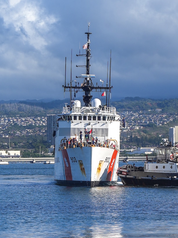 U.S. Coast Guardsmen assigned to the medium endurance cutter USCGC Harriet Lane (WMEC 903) prepare to moor at Joint Base Pearl Harbor-Hickam in Honolulu Oct. 6, 2025. During their 81-day deployment, the crew patrolled more than 16,000 nautical miles, conducting joint operations and territorial integrity missions across Oceania. (U.S. Coast Guard photo by Petty Officer 3rd Class Jennifer Nilson)