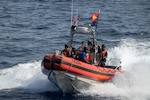 U.S. Coast Guardsmen assigned to the medium endurance cutter USCGC Harriet Lane (WMEC 903) and Papua New Guinea Customs and Fishery officers prepare to board fishing vessels in the Papua New Guinea exclusive economic zone Oct. 20, 2025. Through a bilateral maritime law enforcement agreement with Papua New Guinea, the Harriet Lane crew worked with partners to board seven fishing vessels, resulting in one potential violation and one voyage termination. (U.S. Coast Guard photo by Petty Officer 3rd Class Austin Wiley)