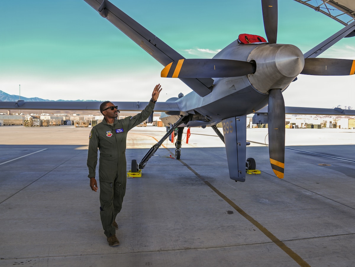 U.S. Air Force 1st Lt. Quincy Brayton, 22nd Attack Squadron MQ-9 Reaper pilot, conducts a preflight inspection at Creech Air Force Base, Nevada, Dec. 4, 2025. Brayton, whose aviation journey began as an enlisted maintainer, now mentors aspiring aviators through the FlyBraviation Foundation, a nonprofit he created to help others pursue pilot training.