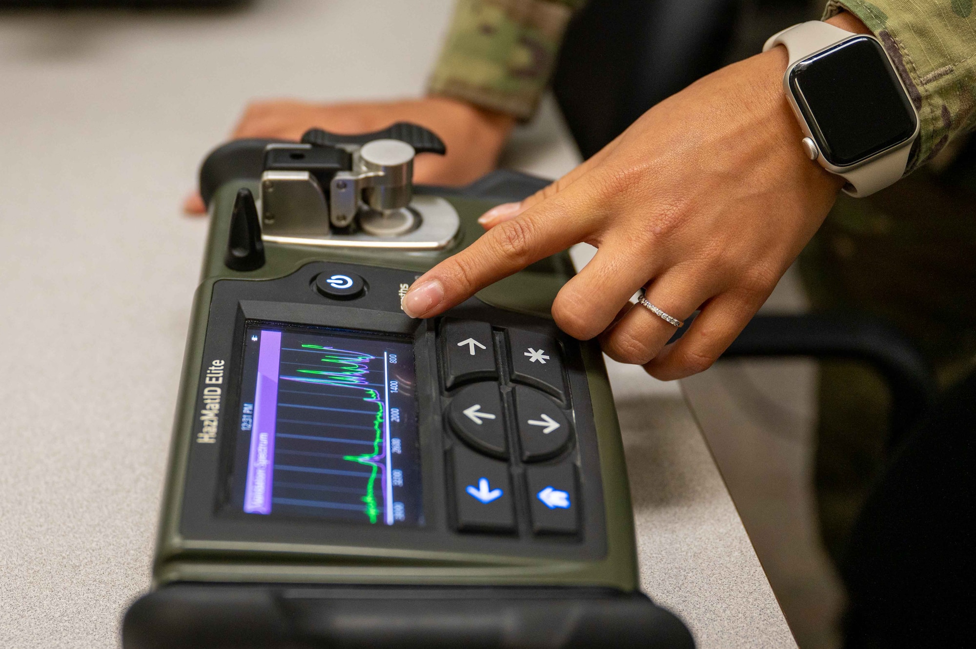 U.S. Air Force Airman 1st Class Arely Ramirez-Munoz, bioenvironmental engineering technician, Maxwell Medical Group, calibrates a handheld hazardous material identifier at Maxwell Air Force base, Alabama, Oct. 30, 2025. The identifier is used by the bioenvironmental engineering team to identify unknown solid and liquid chemicals in the field. (U.S. Air Force photo by Senior Airman Evan Porter)