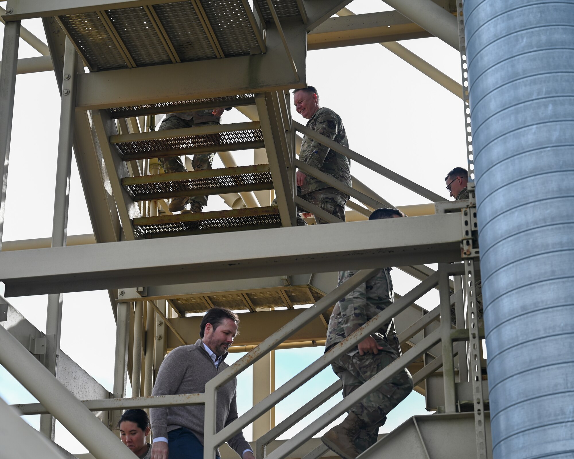 A Team Vandenberg Guardian Nexus Tour group climbs up a Minotaur rocket gantry at Space Launch Complex 8 at Vandenberg Space Force Base.