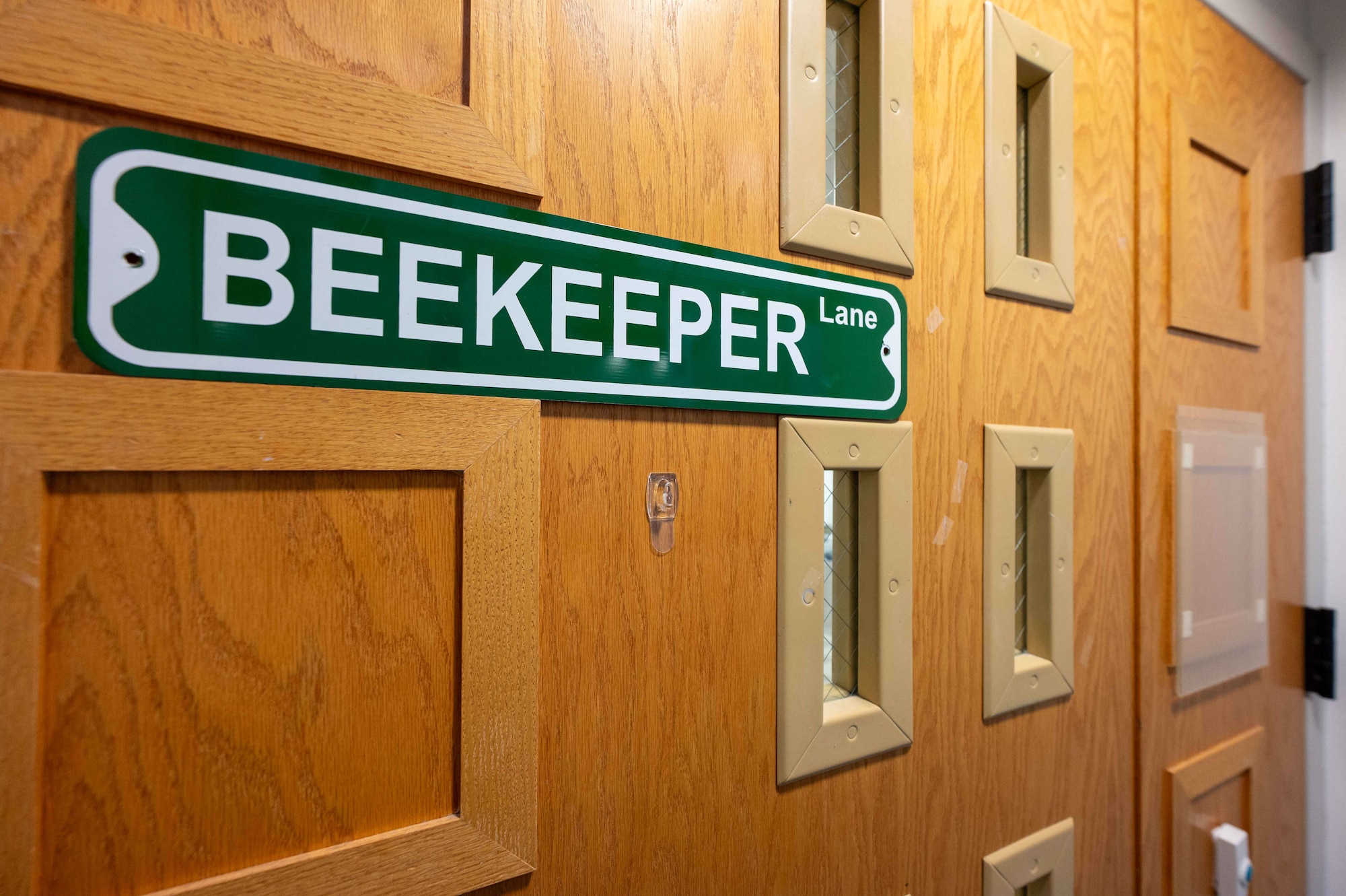 A sign is displayed outside of the Maxwell Medical Group bioenvironmental engineering flight shop at Maxwell Air Force Base, Alabama, Oct. 30, 2025. The Maxwell Medical Group BEE flight is responsible for monitoring 27 industrial shops on Maxwell, assessing everything from air quality to chemical exposure. (U.S. Air Force photo by Senior Airman Evan Porter)