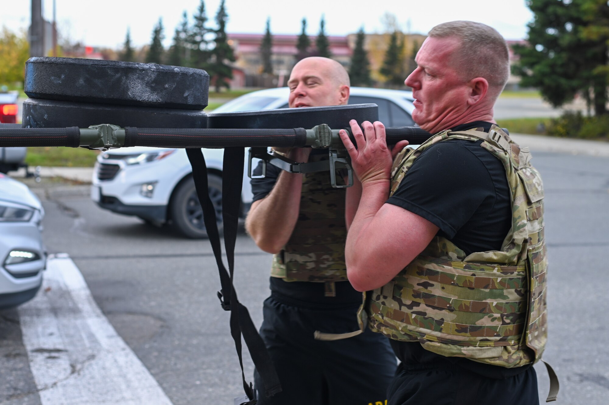 Soldiers lift a weighted stretcher together while participating in the Mogadishu Mile, an event on Joint Base Elmendorf-Richardson, Alaska, Oct. 3, 2025. The Mogadishu Mile was organized by the JBER Chaplain Corps to foster resilience amongst troops as well as pay homage to the Soldiers who fought in the Battle of Mogadishu in 1993. (U.S. Air Force photo by Airman 1st Class Eli A. Rose)