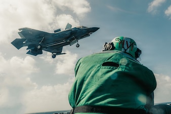 A U.S. Marine Corps F-35B Lightning II assigned to Marine Fighter Attack Squadron (VMFA) 242 , 31st Marine Expeditionary Unit, prepares to land aboard the forward-deployed amphibious assault carrier USS Tripoli (LHA 7), flagship of the Tripoli Expeditionary Strike Group, Dec. 7, 2025, while conducting routine operations in the U.S. 7th Fleet Area of Operations