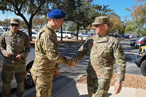 Sixteenth Air Force commander greets Polish Cyber Commander.