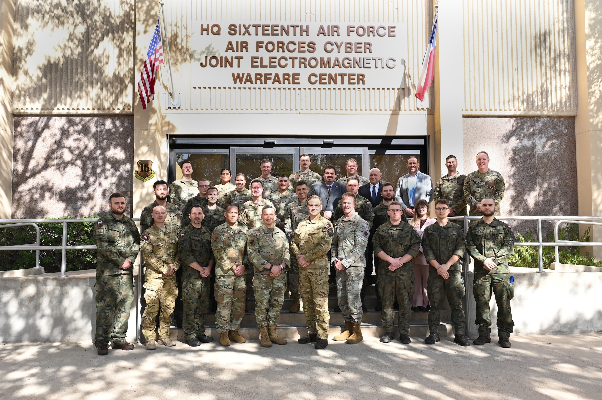 Sixteenth Air Force and Polish Cyber Command leadership pose for a group photo.