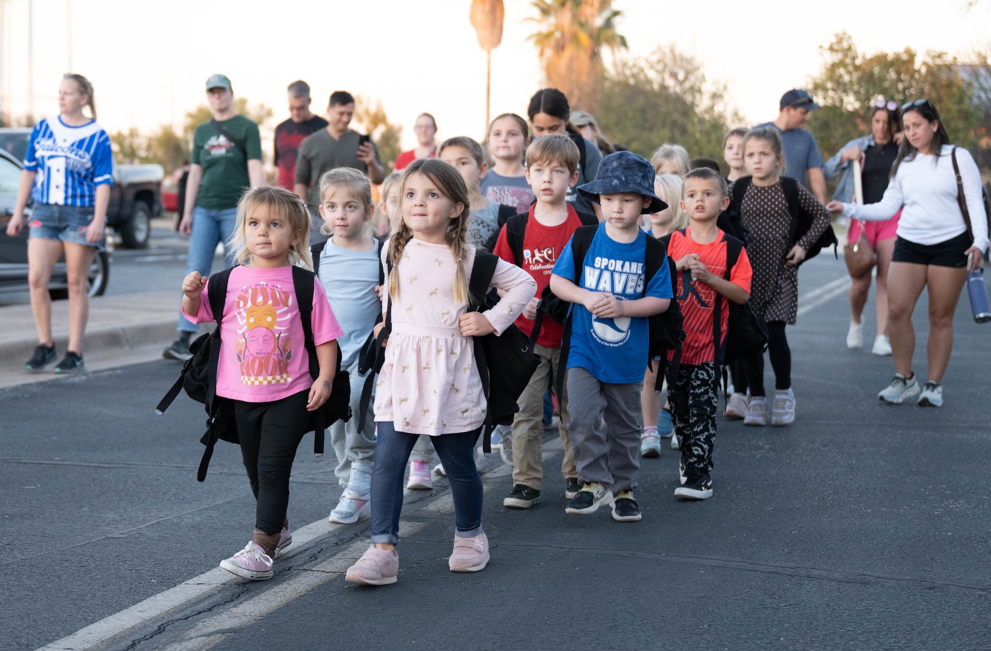 A group of Junior Deployment participants walk to their next station during a Junior Deployment event at Laughlin Air Force Base, Texas, Nov. 21, 2025. The event held various activities that simulated deployment events for children of military members. (U.S. Air Force photo by Airman 1st Class Darryl Keith)