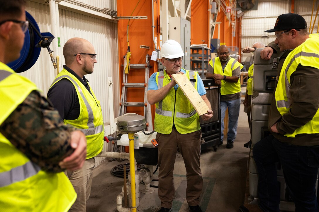 Contractor John Borén, an OSHA-authorized outreach trainer, demonstrates a building inspection during the OSHA 10-hour general industry outreach training Dec. 10, 2025, at Marine Corps Support Facility Blount Island in Florida. The training is helping build a safer, more resilient workforce, ready to support Marine Corps global mission objectives. (Official Marine Corps photo by Dustin Senger)