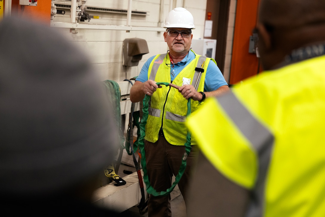 Contractor John Borén, an OSHA-authorized outreach trainer, demonstrates a building inspection during the OSHA 10-hour general industry outreach training Dec. 10, 2025, at Marine Corps Support Facility Blount Island in Florida. The training is helping build a safer, more resilient workforce, ready to support Marine Corps global mission objectives. (Official Marine Corps photo by Dustin Senger)