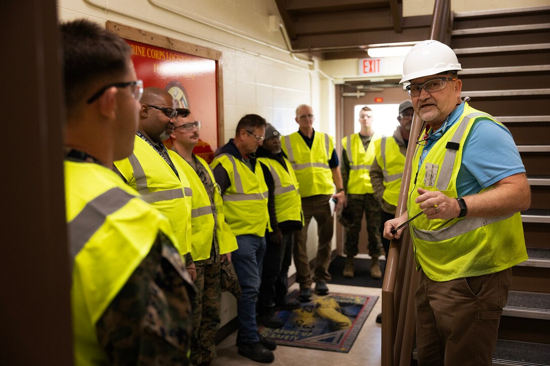 Contractor John Borén, an OSHA-authorized outreach trainer, demonstrates a building inspection during the OSHA 10-hour general industry outreach training Dec. 10, 2025, at Marine Corps Support Facility Blount Island in Florida. The training is helping build a safer, more resilient workforce, ready to support Marine Corps global mission objectives. (Official Marine Corps photo by Dustin Senger)