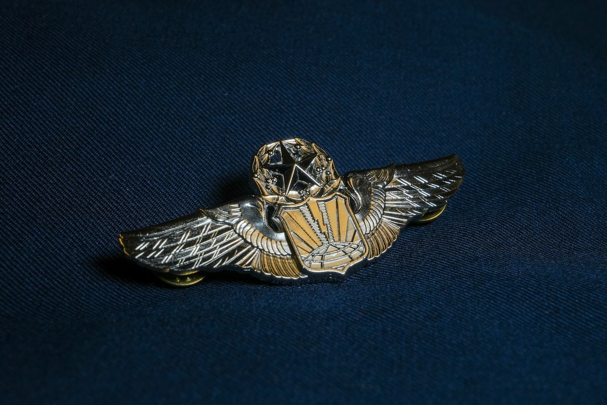 A pair of command pilots sits on a table.