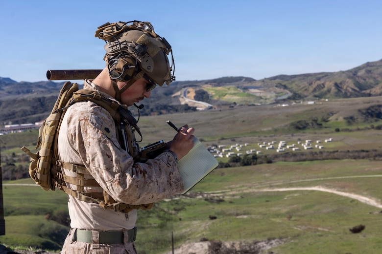 U.S. Marine Corps Sgt. Bryce Nelson, a joint terminal attack controller with 11th Marine Regiment, 1st Marine Division, takes notes prior to giving terminal guidance for air delivered munitions during exercise Steel Knight 25 at Marine Corps Base Camp Pendleton, California, Dec. 4, 2025