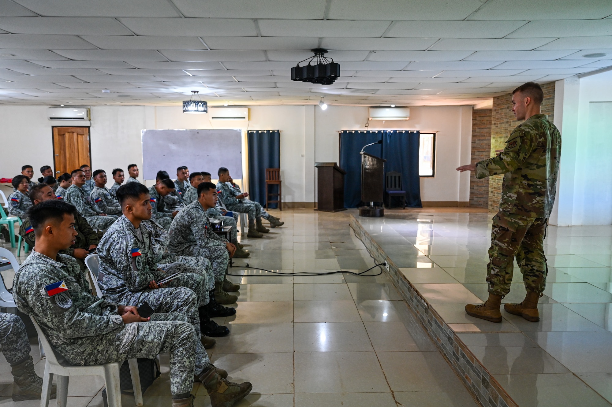 U.S. Air Force Technical Sgt. Patrick O’Neil, 11th Combat Air Base Squadron training and logistics manager, gives opening remarks at the subject matter expert information exchange at Antonio Bautista Air Base, Philippines, Oct. 21, 2025.