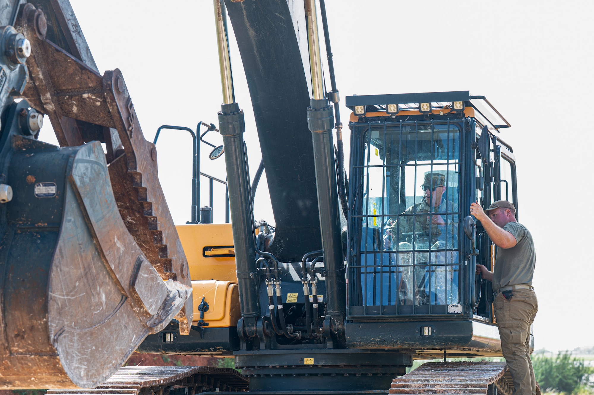 U.S. Air Force Col. Brett Cassidy, 11th Air Task Force commander, tours heavy machinery and meets with the civil engineering operators from the 11th Combat Air Base Squadron taking part in the groundbreaking labor at Andersen Air Force Base on Nov. 17, 2025.