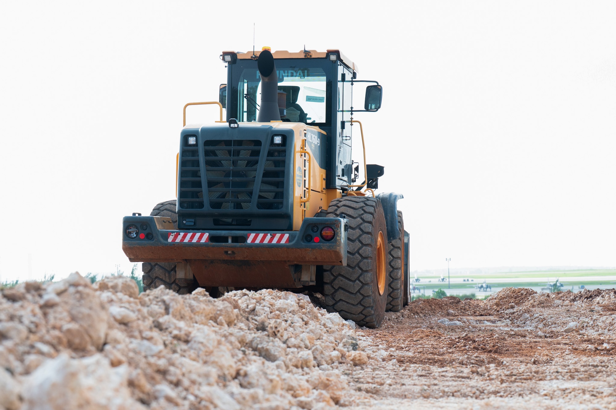 A bulldozer assigned to the 36th Civil Engineer Squadron sits on the dirt before heavy machine operators from the 11th Combat Air Base Squadron and the 36th CES begin removing debris from the construction site at Andersen Air Force Base on Nov. 18, 2025.