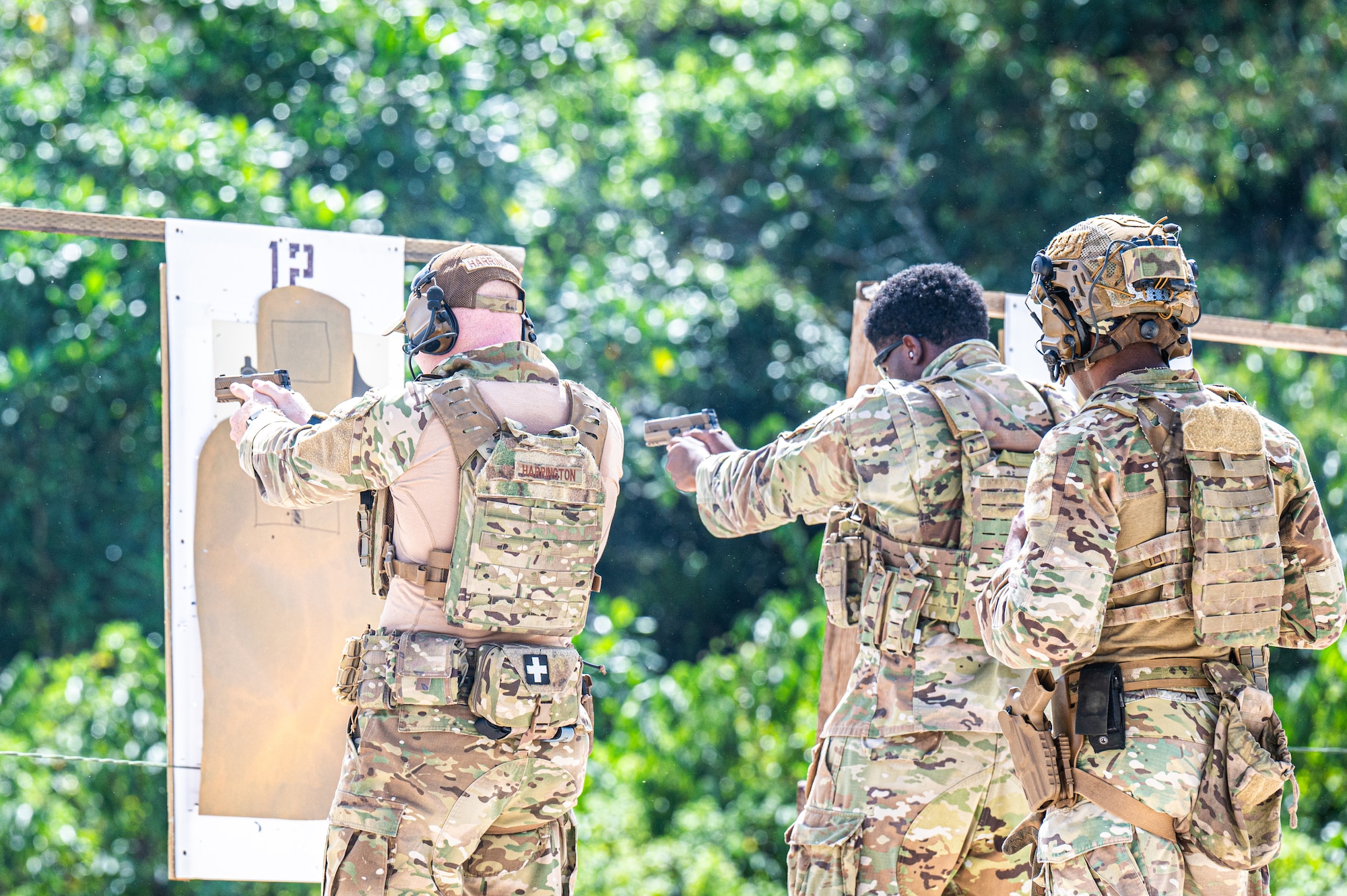 U.S. Air Force Airmen from the 824th Base Defense Squadron and the 11th Combat Air Base Squadron fire Sig Sauer M18s at targets during live-fire range training at Andersen Air Force Base, Guam, Nov. 14, 2025.
