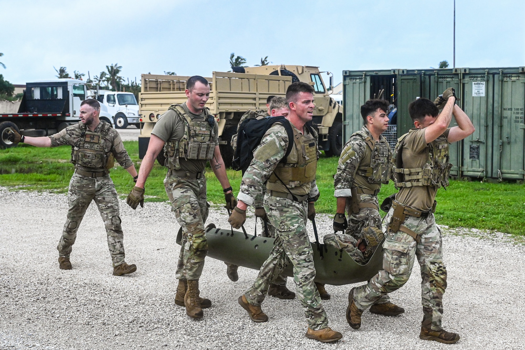 U.S. Air Force Airmen from the 824th Base Defense Squadron and the 11th Combat Air Base Squadron move a simulated patient to practice tactical combat casualty care at Andersen Air Force Base, Guam, Nov. 7, 2025.