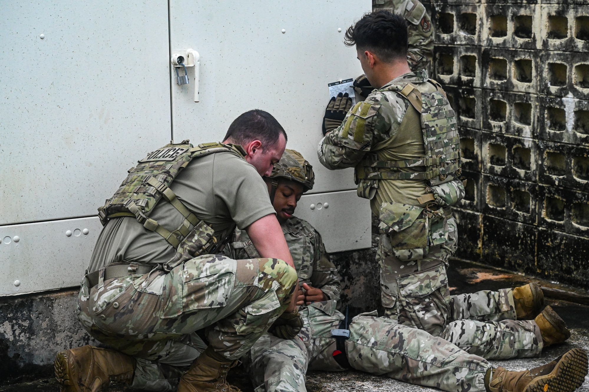 U.S. Air Force Airmen from the 824th Base Defense Squadron and the 11th Combat Air Base Squadron triage a simulated patient during tactical combat casualty care at Andersen Air Force Base, Guam, Nov. 7, 2025.