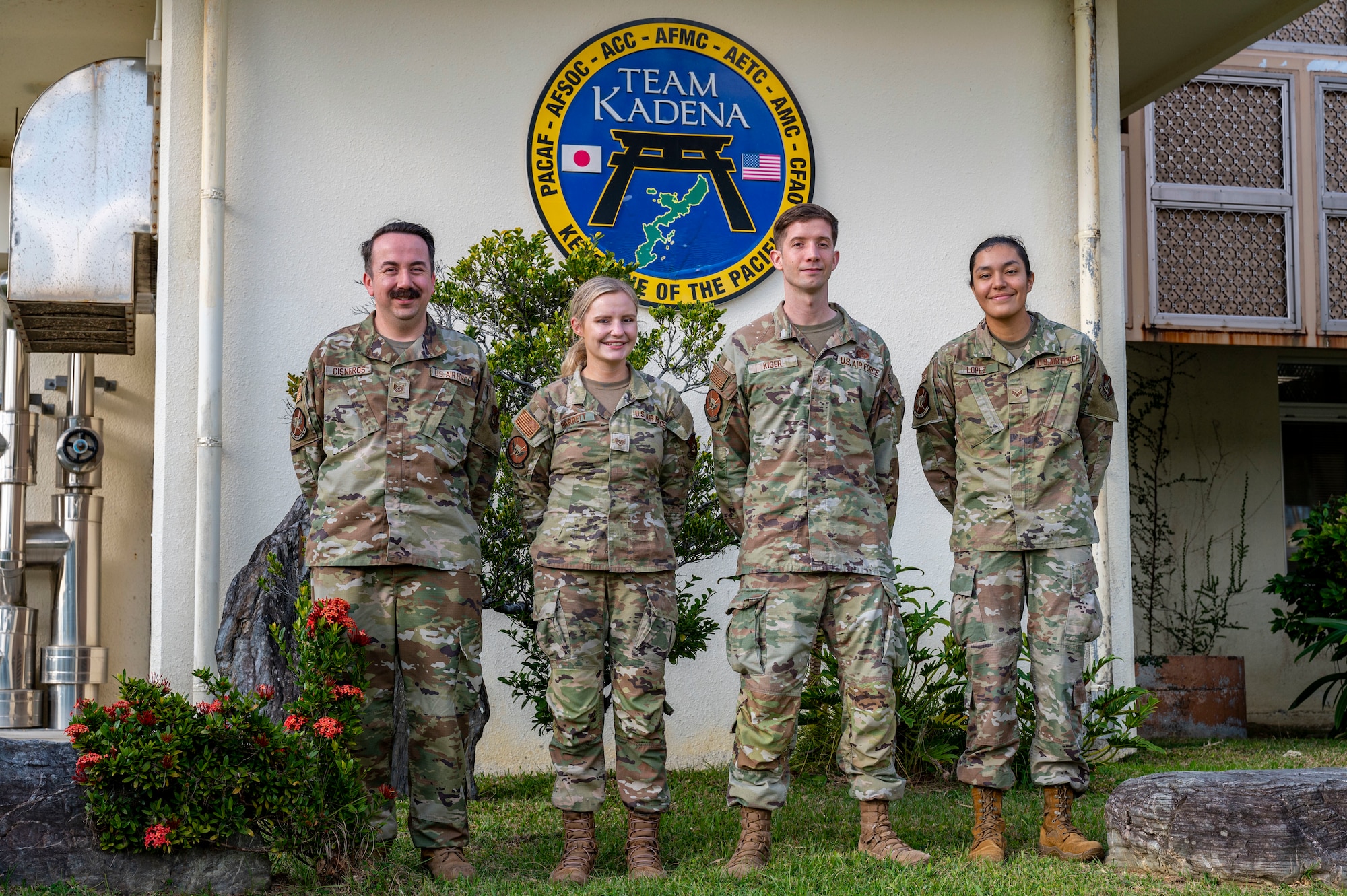 Members of the 18th Operational Support Squadron airfield management flight pose for a photo on Kadena Air Base, Japan, Dec. 11, 2025.