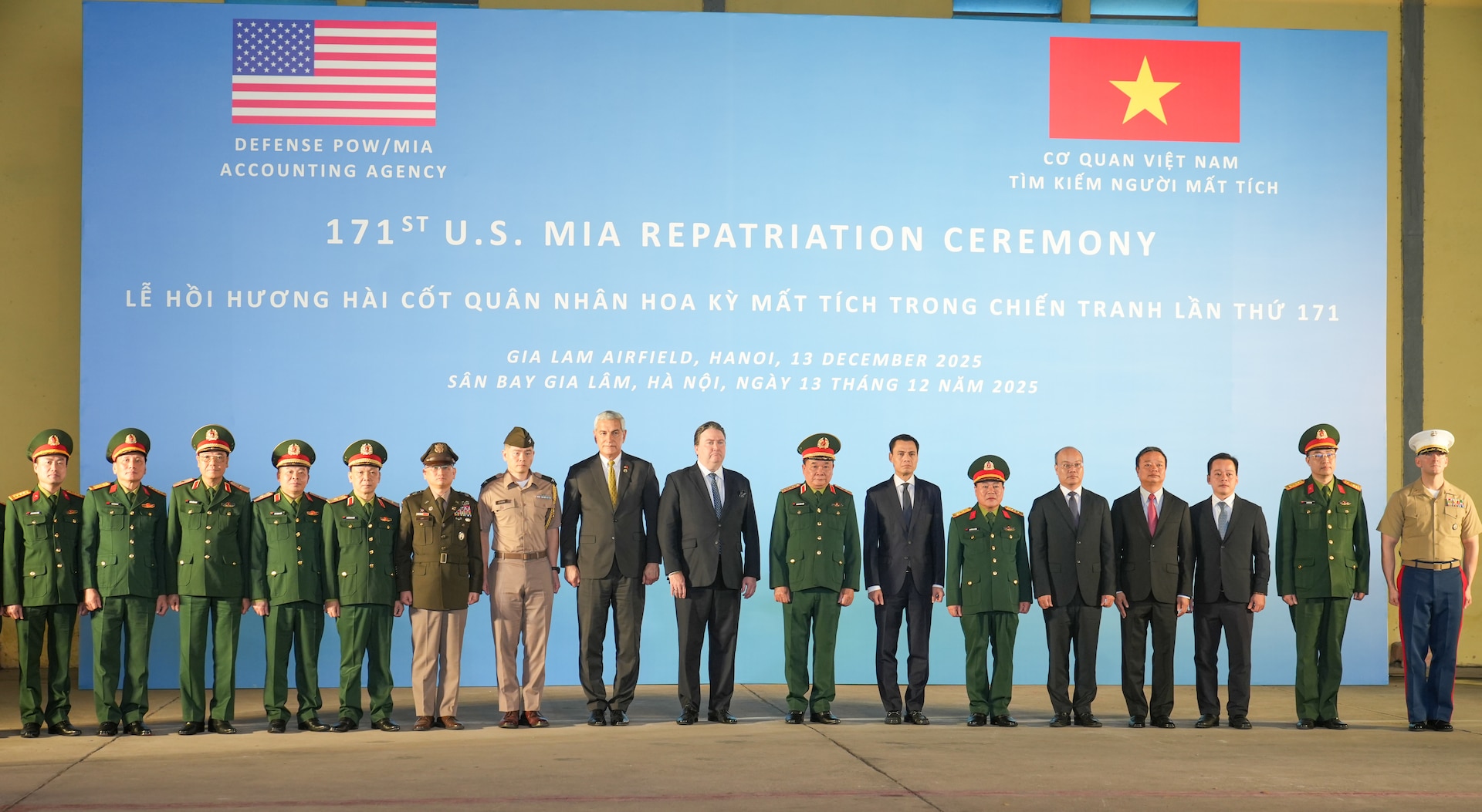 American and Vietnamese officials stand for a group picture during the 171st Repatriation Ceremony at the Gia Lam Airfield, Hanoi, Vietnam, on Dec. 13, 2025.