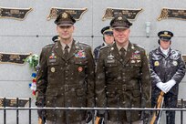 Maj. Gen. Lawrence "Larry" Muennich, Indiana National Guard adjutant general, left, and Command Sgt. Maj. Joshua A. Brown, Indiana National Guard state command sergeant major, pose for a photo at Crown Hill Cemetery in Indianapolis Dec. 13, 2025. Muennich and Brown joined Indiana military and civic leaders, veteran and patriotic organizations, and members of the public to place wreaths on the graves of veterans in the cemetery as part of a Wreaths Across America event. (U.S. Army photo by Mark R. W. Orders-Woempner)