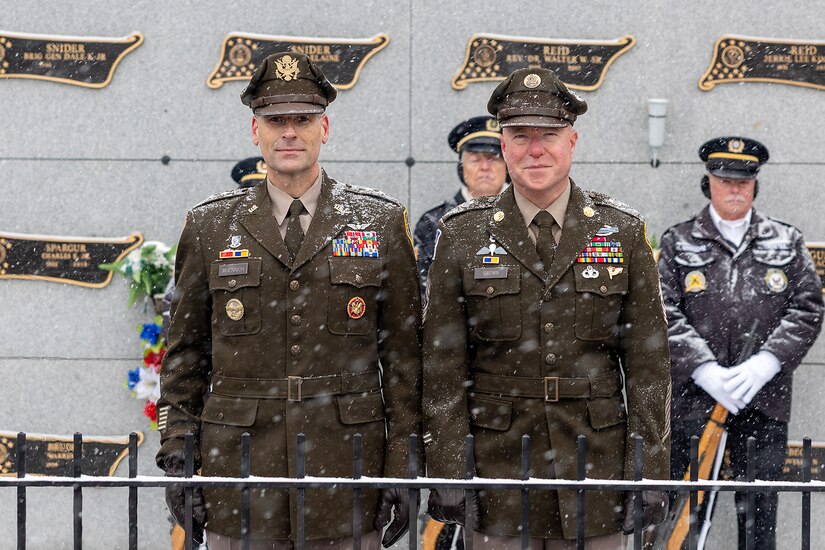 Maj. Gen. Lawrence "Larry" Muennich, Indiana National Guard adjutant general, left, and Command Sgt. Maj. Joshua A. Brown, Indiana National Guard state command sergeant major, pose for a photo at Crown Hill Cemetery in Indianapolis Dec. 13, 2025. Muennich and Brown joined Indiana military and civic leaders, veteran and patriotic organizations, and members of the public to place wreaths on the graves of veterans in the cemetery as part of a Wreaths Across America event. (U.S. Army photo by Mark R. W. Orders-Woempner)