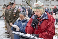 Margaret Smith, Daughters of the American Revolution Caroline Scott Harrison Chapter chaplain, prays during a Wreaths Across America event at Crown Hill Cemetery in Indianapolis Dec. 13, 2025. This year, more than two million volunteers and supporters gathered to remember, honor and teach by laying wreaths on the graves of veterans at more than 5,200 participating locations in all 50 states, at sea and abroad. (U.S. Army photo by Mark R. W. Orders-Woempner)