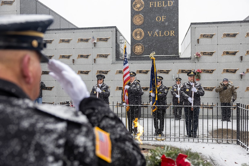 Members of the Indy Metropolitan Military Honor Guard present the Colors during a Wreaths Across America event at Crown Hill Cemetery in Indianapolis Dec. 13, 2025. This year, more than two million volunteers and supporters gathered to remember, honor and teach by laying wreaths on the graves of veterans at more than 5,200 participating locations in all 50 states, at sea and abroad. (U.S. Army photo by Mark R. W. Orders-Woempner)