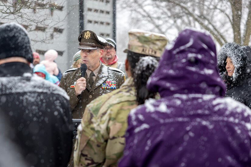 Maj. Gen. Lawrence "Larry" Muennich, Indiana National Guard adjutant general, delivers remarks as Command Sgt. Maj. Joy L. Allen, U.S. Army Financial Management Command senior enlisted advisor, listens alongside military and civic leaders, and members of the public during a Wreaths Across America event at Crown Hill Cemetery in Indianapolis Dec. 13, 2025. This year, more than two million volunteers and supporters gathered to remember, honor and teach by laying wreaths on the graves of veterans at more than 5,200 participating locations in all 50 states, at sea and abroad. (U.S. Army photo by Mark R. W. Orders-Woempner)