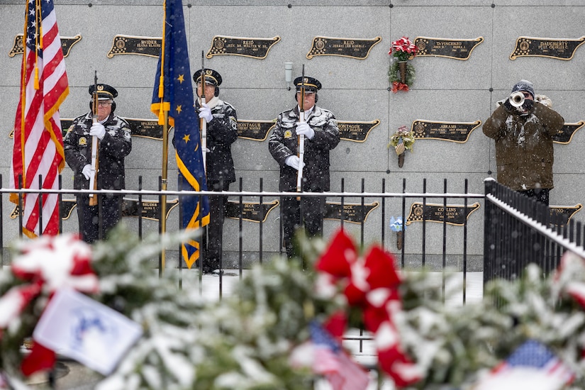 Members of the Indy Metropolitan Military Honor Guard present the Colors as “Taps” is played during a Wreaths Across America event at Crown Hill Cemetery in Indianapolis Dec. 13, 2025. This year, more than two million volunteers and supporters gathered to remember, honor and teach by laying wreaths on the graves of veterans at more than 5,200 participating locations in all 50 states, at sea and abroad. (U.S. Army photo by Mark R. W. Orders-Woempner)
