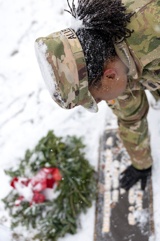 Command Sgt. Maj. Joy L. Allen, U.S. Army Financial Management Command senior enlisted advisor, cleans off the grave of U.S. Army Staff Sgt. Beecham Lockhart, Jr., a Vietnam veteran who passed in 2024, during a Wreaths Across America event at Crown Hill Cemetery in Indianapolis Dec. 13, 2025. This year, more than two million volunteers and supporters gathered to remember, honor and teach by laying wreaths on the graves of veterans at more than 5,200 participating locations in all 50 states, at sea and abroad. (U.S. Army photo by Mark R. W. Orders-Woempner)