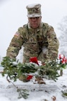 Command Sgt. Maj. Joy L. Allen, U.S. Army Financial Management Command senior enlisted advisor, places a wreath on the grave of U.S. Army Staff Sgt. Beecham Lockhart, Jr., a Vietnam veteran who passed in 2024, during a Wreaths Across America event at Crown Hill Cemetery in Indianapolis Dec. 13, 2025. This year, more than two million volunteers and supporters gathered to remember, honor and teach by laying wreaths on the graves of veterans at more than 5,200 participating locations in all 50 states, at sea and abroad. (U.S. Army photo by Mark R. W. Orders-Woempner)