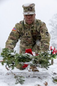 Command Sgt. Maj. Joy L. Allen, U.S. Army Financial Management Command senior enlisted advisor, places a wreath on the grave of U.S. Army Staff Sgt. Beecham Lockhart, Jr., a Vietnam veteran who passed in 2024, during a Wreaths Across America event at Crown Hill Cemetery in Indianapolis Dec. 13, 2025. This year, more than two million volunteers and supporters gathered to remember, honor and teach by laying wreaths on the graves of veterans at more than 5,200 participating locations in all 50 states, at sea and abroad. (U.S. Army photo by Mark R. W. Orders-Woempner)