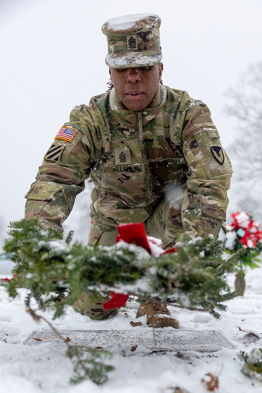 Command Sgt. Maj. Joy L. Allen, U.S. Army Financial Management Command senior enlisted advisor, places a wreath on the grave of U.S. Army Staff Sgt. Beecham Lockhart, Jr., a Vietnam veteran who passed in 2024, during a Wreaths Across America event at Crown Hill Cemetery in Indianapolis Dec. 13, 2025. This year, more than two million volunteers and supporters gathered to remember, honor and teach by laying wreaths on the graves of veterans at more than 5,200 participating locations in all 50 states, at sea and abroad. (U.S. Army photo by Mark R. W. Orders-Woempner)