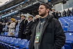 BALTIMORE (Dec. 13, 2025) - A Naval Criminal Investigative Service Special Agent, assigned to the Protective Services Field Office, ensures the safety of Chief of Naval Operations Adm. Daryl Caudle under the executive protection coverage during the 126th Army-Navy game at MT&T Stadium in Baltimore, Dec. 13, 2025. NCIS protective operations agents specialize in protective operations, and are specifically trained to anticipate dangers, plan safe escape routes, and respond instantly. (U.S. Navy photo by Mass Communication Specialist 2nd Class Kaitlyn E. Eads)