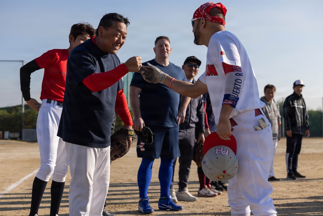 U.S. service members and on-base personnel from Marine Corps Air Station Iwakuni participate in a softball tournament with the local community in Iwakuni city, Japan, Nov. 23, 2025. This tournament was held to strengthen relationships between U.S. service members and the Iwakuni community through food, fun and friendly competition. (U.S. Marine Corps photo by Lance Cpl. Ella Cadby)