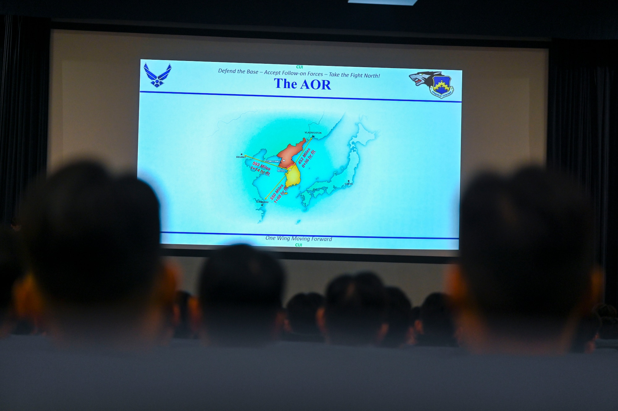 People look at a screen.