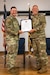 Col. Kevin Krauss, left, commander of the 123rd Mission Support Group, presents a certificate of retirement to Chief Master Sgt. Krome Raymond during a ceremony at the Kentucky Air National Guard Base in Louisville, Ky., Sept. 7, 2025. Raymond, senior enlisted leader for the 123rd Mission Support Group, served 22 years in both the active-duty Air Force and Kentucky Air Guard during three periods of enlistment spread over 38 years. (U.S. Air National Guard photo by Senior Airman Annaliese Billings)