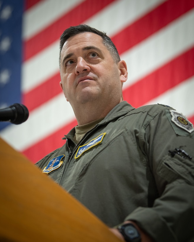 Col. Matthew Quenichet, commander of the 123rd Airlift Wing, speaks during an award ceremony in which the wing received its 21st Air and Space Outstanding Unit Award at the Kentucky Air National Guard Base in Louisville, Ky., Dec. 14, 2025. The new honor, previously known as the Air Force Outstanding Unit Award, continues the unit’s legacy as the most decorated tactical airlift wing in the United States Air Force. (U.S. Air National Guard photo by Master Sgt. Joshua Horton)